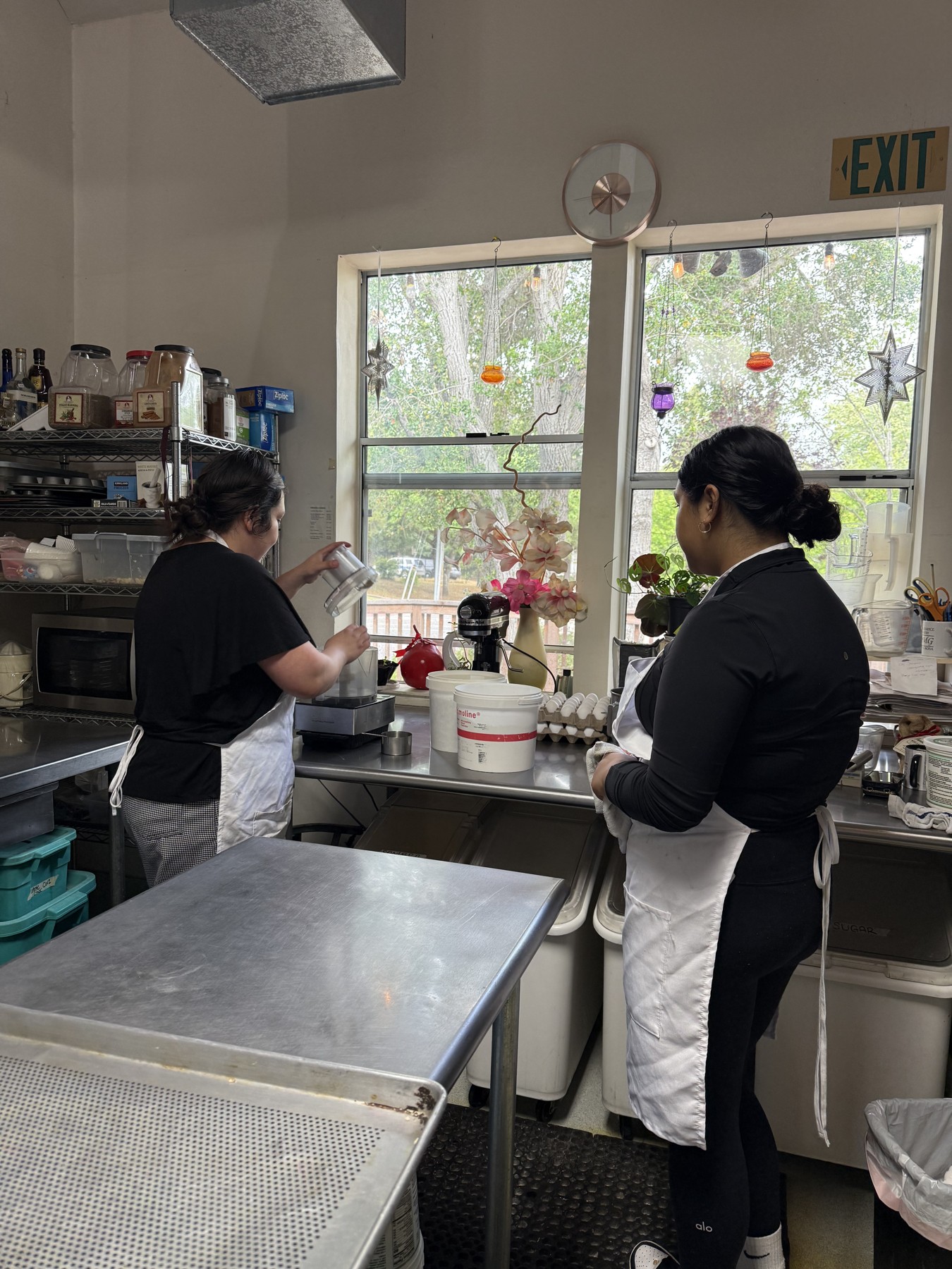 Students practicing skills in a teaching kitchen