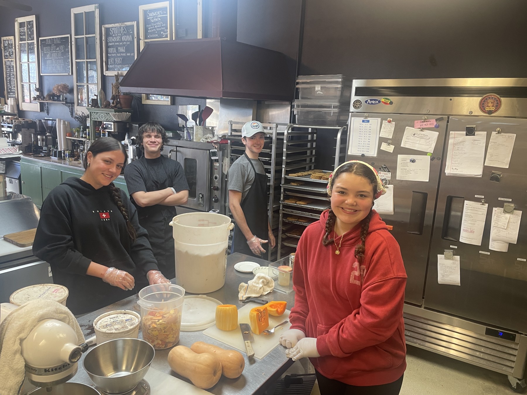 Students preparing food together in a teaching kitchen